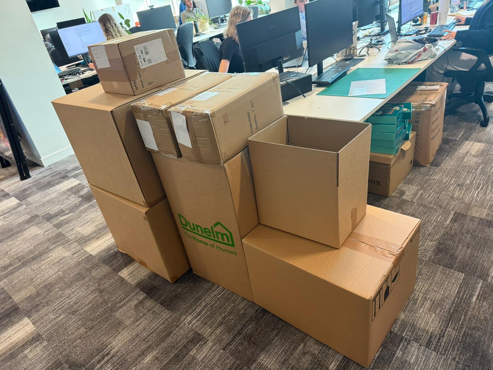A stack of boxes ready for collection in an office
